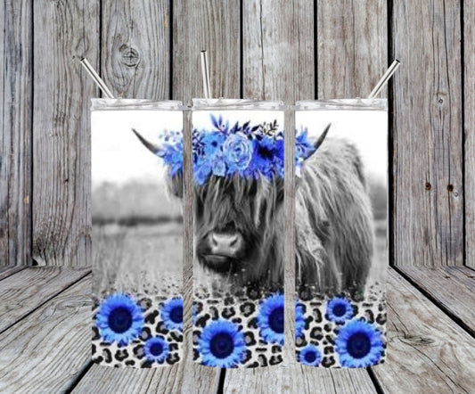 cow with blue sunflowers